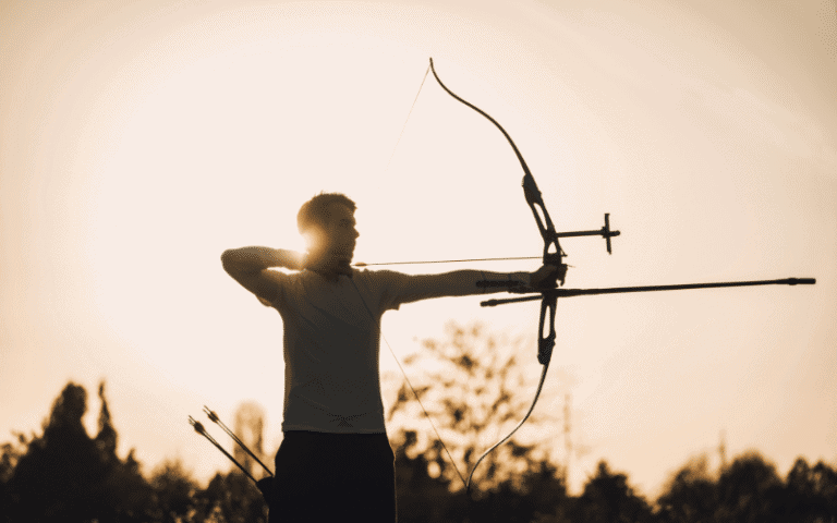 Improve target shooting techniques: A bow and arrow aimed at a bullseye on a target, with arrows scattered around the outer edges